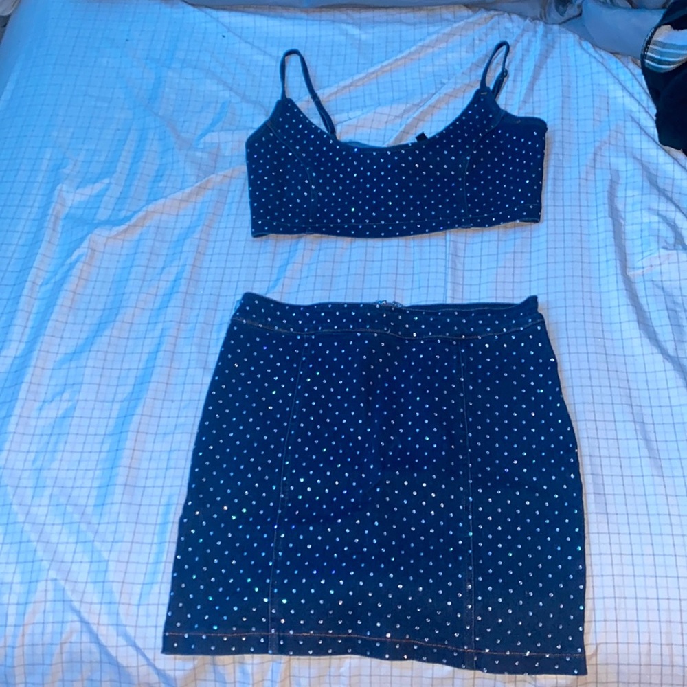 This is a two piece denim skirt set with diamonds on it very pretty!!